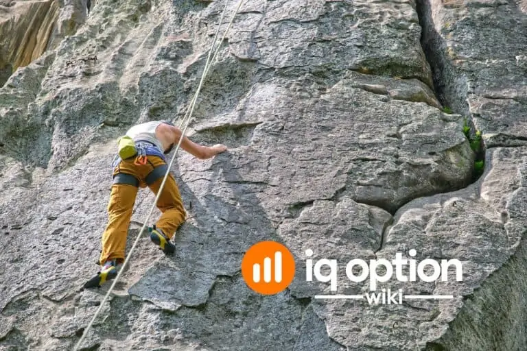 Climber secured by safety equipment on a steep rock face